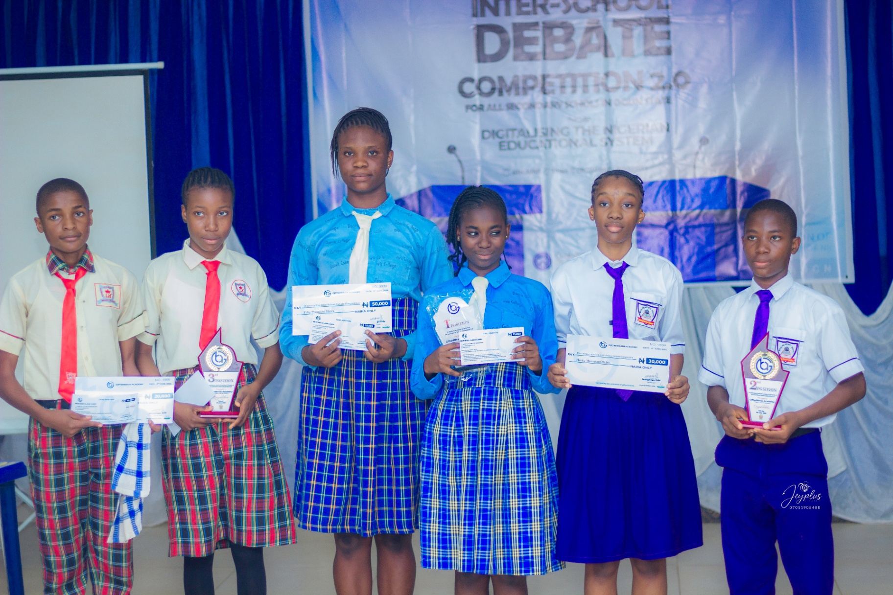 Top finalists holding trophies at Competition 2.0